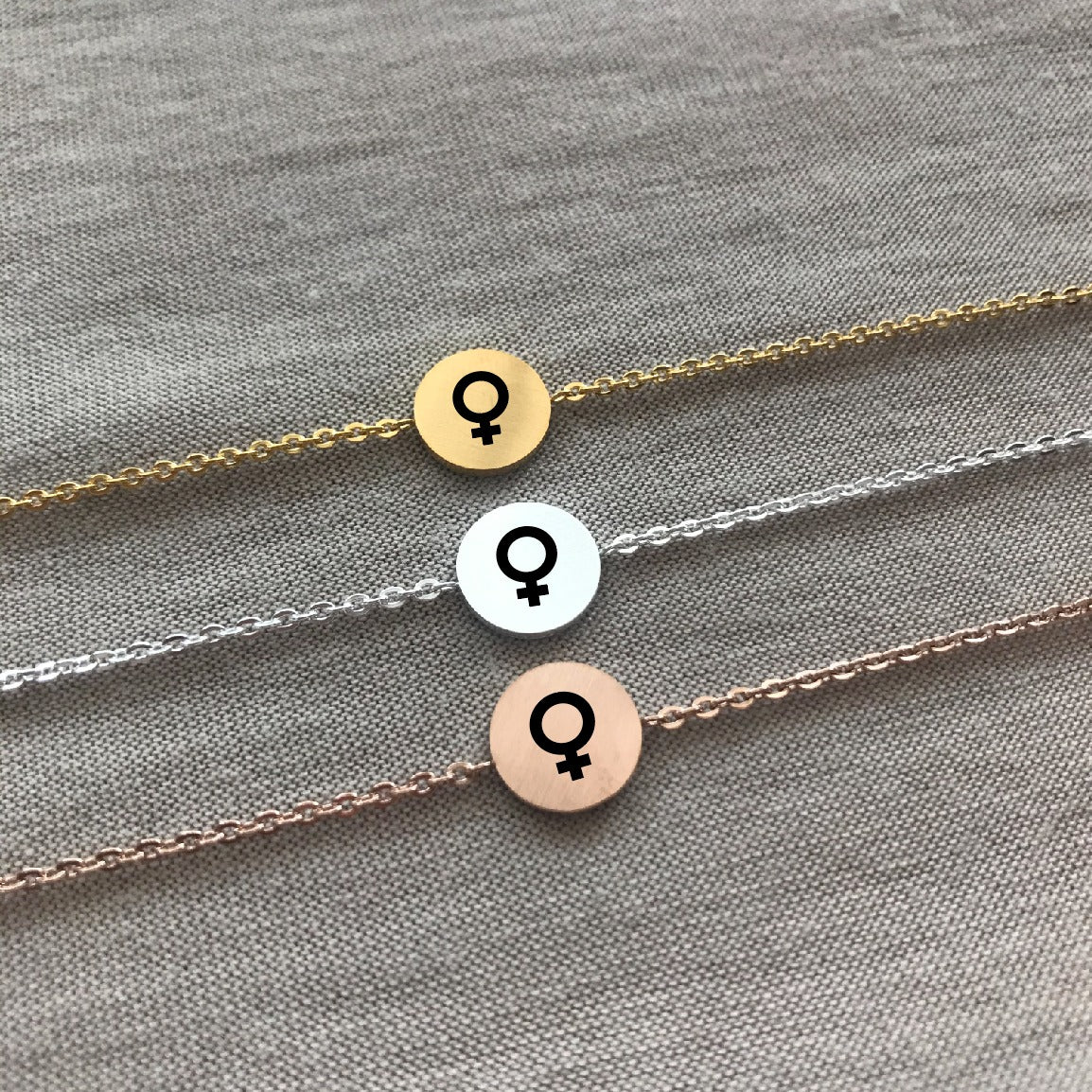 Pulsera de símbolo femenino